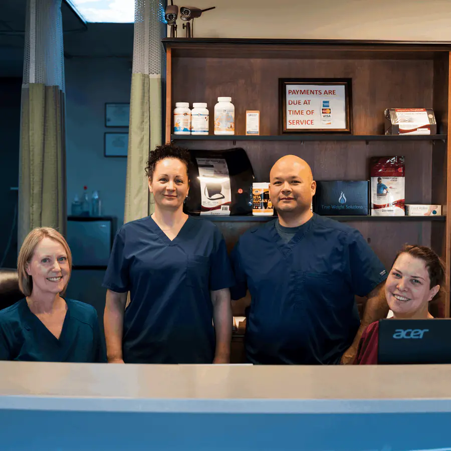 RiverCrest provider consulting warmly with a patient in a clean, modern clinic